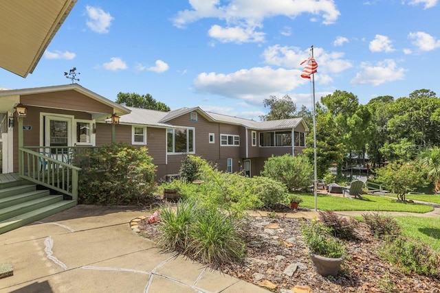 view of front of home with a front yard