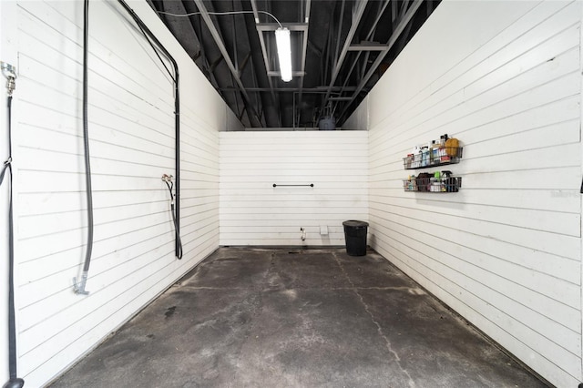 laundry room featuring wooden walls