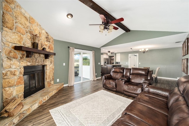 living room with a fireplace, dark wood-type flooring, vaulted ceiling with beams, and ceiling fan