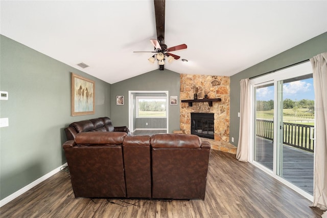 living room featuring a fireplace, lofted ceiling with beams, dark hardwood / wood-style floors, and ceiling fan