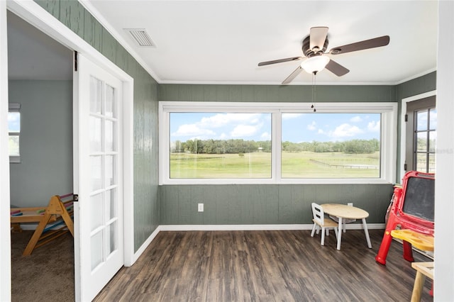 sunroom / solarium with french doors and ceiling fan