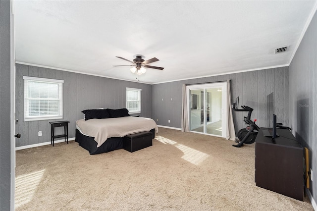 bedroom featuring ceiling fan, multiple windows, and carpet