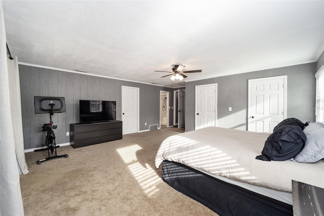 bedroom with ornamental molding, carpet floors, and ceiling fan