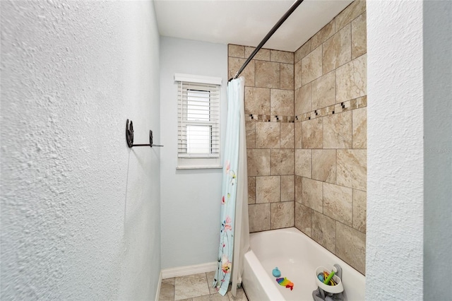 bathroom featuring shower / tub combo with curtain