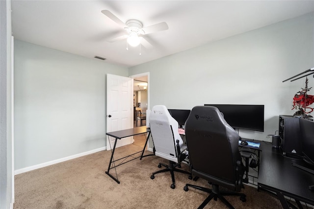 carpeted home office with ceiling fan