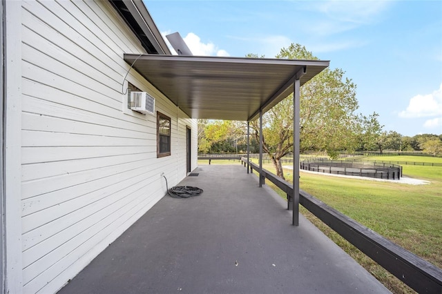 view of patio featuring a wall mounted air conditioner