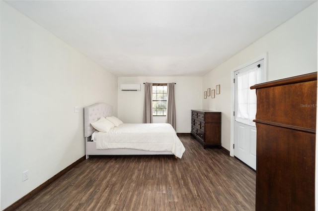 unfurnished bedroom featuring a wall unit AC and dark hardwood / wood-style flooring