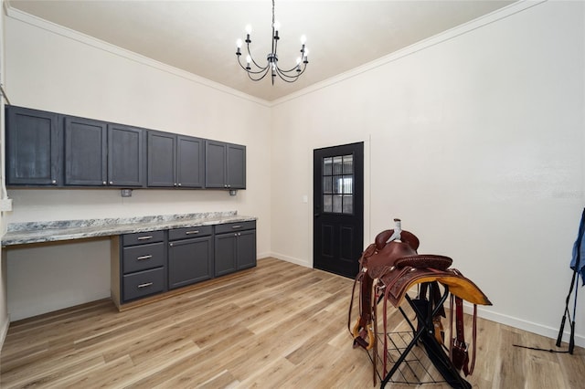 interior space with light wood-type flooring, a notable chandelier, and crown molding