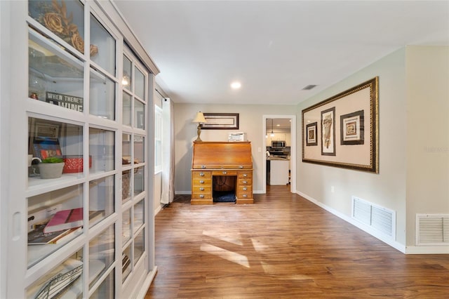 interior space with dark hardwood / wood-style flooring