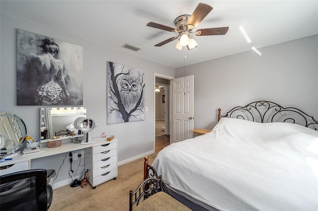 bedroom with ceiling fan and light colored carpet