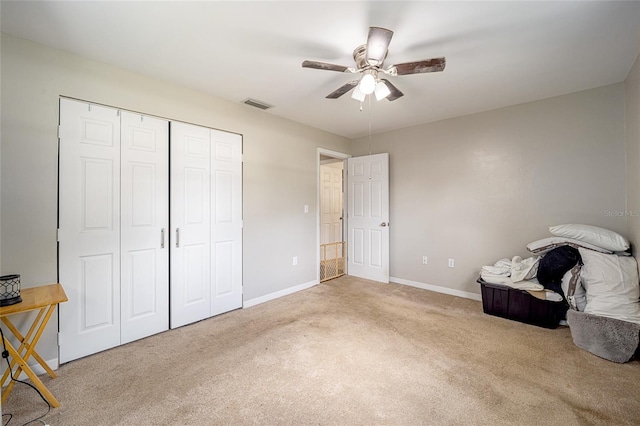 interior space with ceiling fan