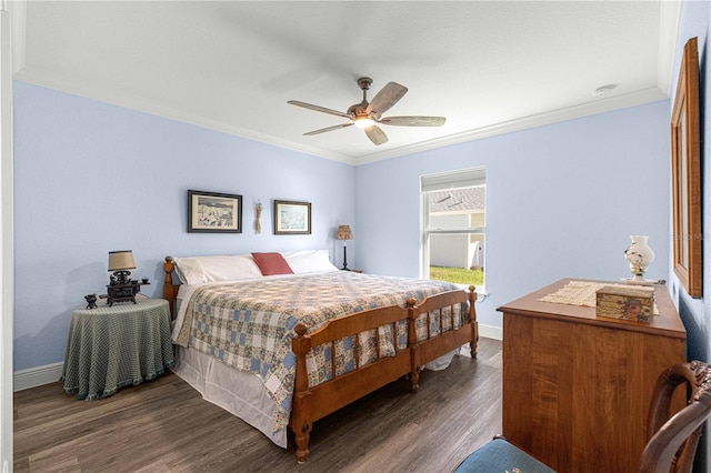 bedroom with dark hardwood / wood-style flooring, ornamental molding, and ceiling fan