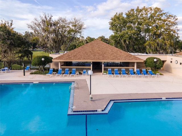 view of swimming pool with a patio