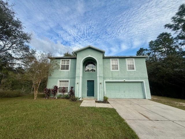 front facade featuring a garage and a front lawn