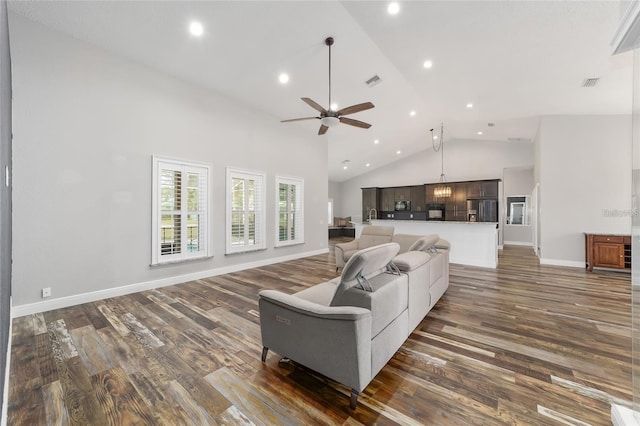 living room with high vaulted ceiling, dark wood-type flooring, and ceiling fan