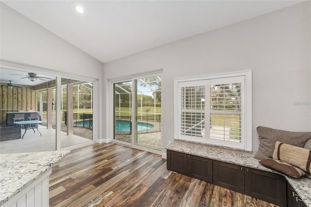 sunroom / solarium with lofted ceiling and ceiling fan