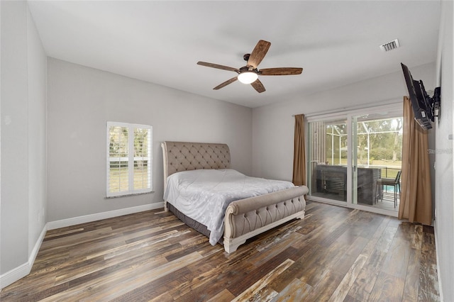 bedroom featuring dark wood-type flooring, ceiling fan, and access to exterior