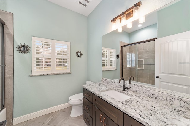 bathroom with walk in shower, toilet, vanity, and tile patterned floors