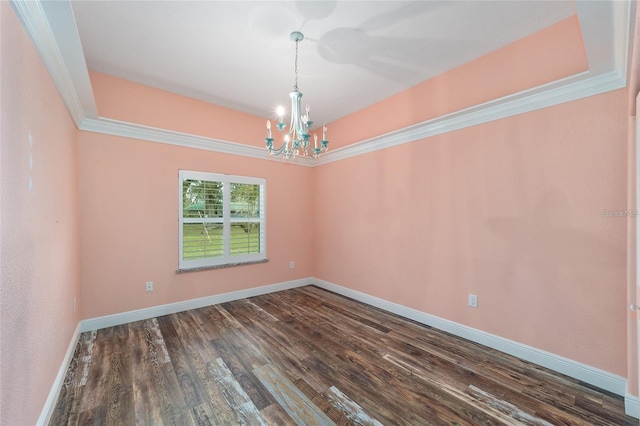 unfurnished room with dark wood-type flooring, crown molding, and a notable chandelier