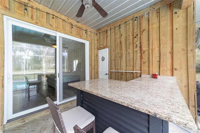 view of patio featuring ceiling fan