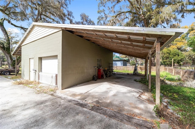 view of parking / parking lot featuring a carport