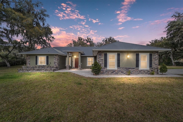 view of front of house with a yard