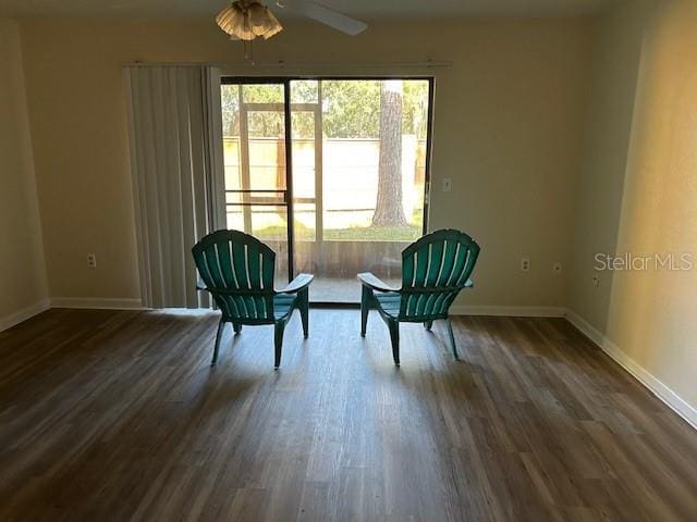 unfurnished room with dark hardwood / wood-style floors and ceiling fan