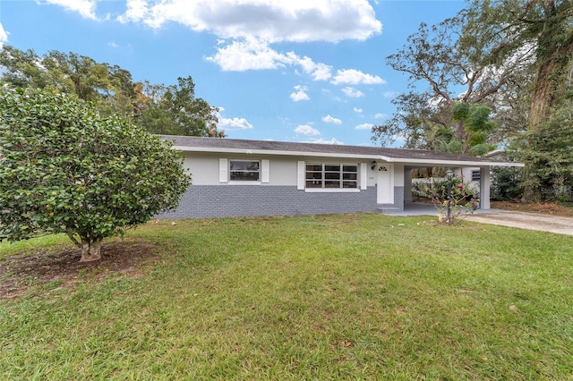 ranch-style home featuring a front yard and a carport