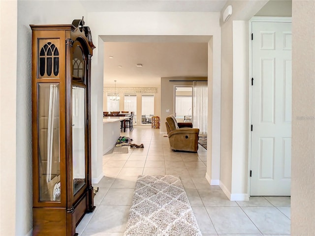 corridor with light tile patterned floors