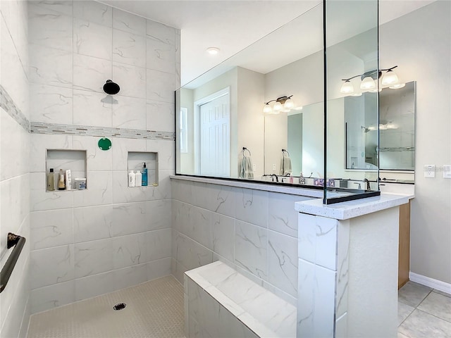 bathroom with tile patterned flooring and tiled shower