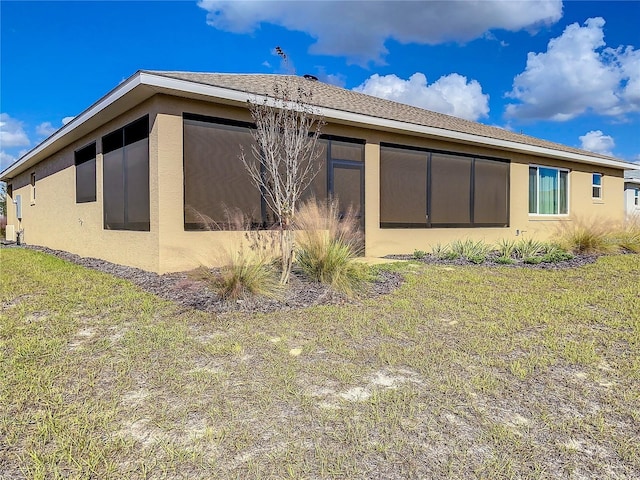 rear view of property with a yard