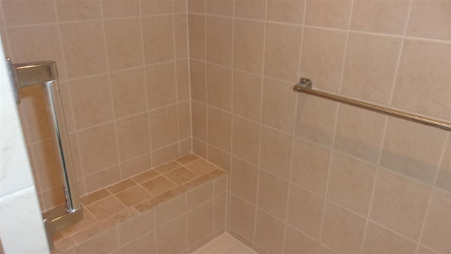 bathroom with a tile shower