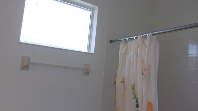 bathroom with a shower with shower curtain