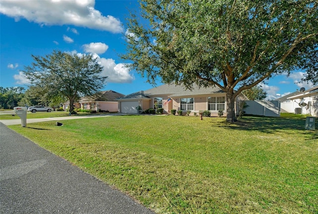 ranch-style house with a front yard and a garage