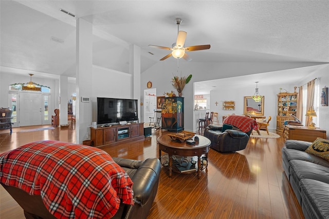 living room featuring ceiling fan, high vaulted ceiling, and wood-type flooring