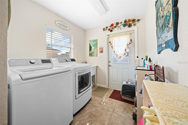 washroom featuring light tile patterned floors and washing machine and clothes dryer