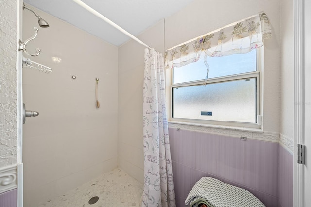 bathroom featuring a shower with curtain