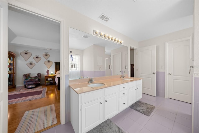 bathroom featuring hardwood / wood-style floors and vanity