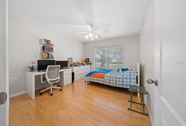 bedroom with ceiling fan and light wood-type flooring