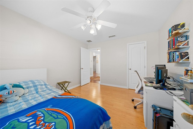 bedroom with ceiling fan and light hardwood / wood-style flooring