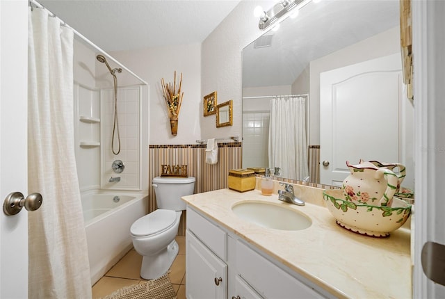 full bathroom featuring tile patterned floors, a textured ceiling, toilet, vanity, and shower / tub combo