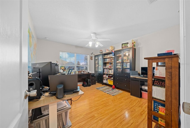 office area with hardwood / wood-style floors and ceiling fan