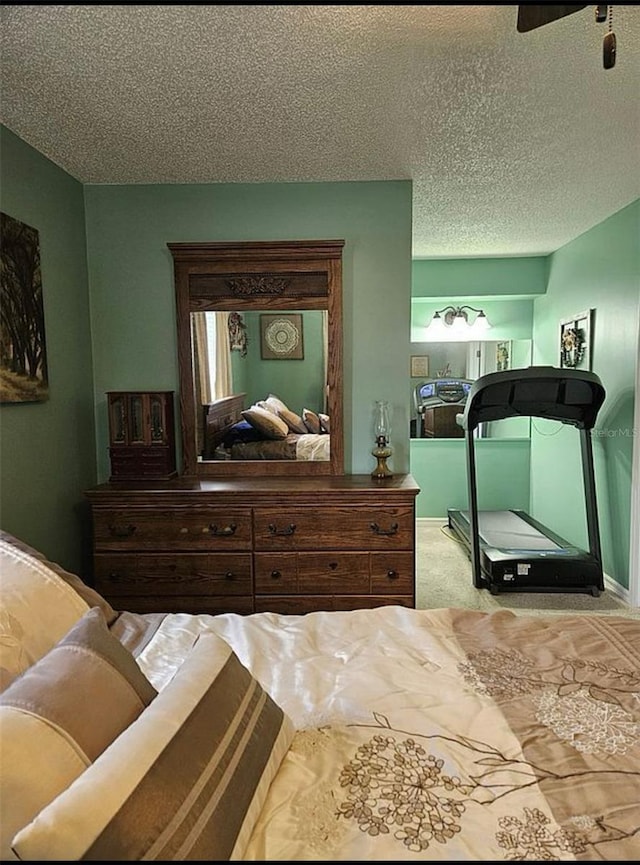 carpeted bedroom featuring a textured ceiling