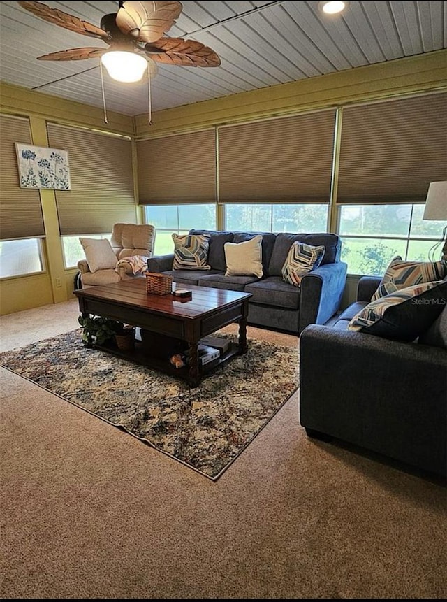 living room featuring wooden ceiling, ceiling fan, and carpet flooring