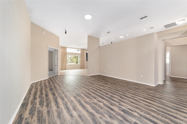 unfurnished room featuring dark hardwood / wood-style flooring