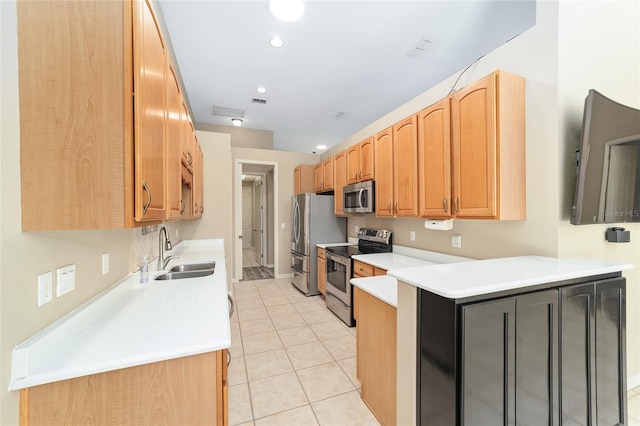 kitchen with stainless steel appliances, sink, and light tile patterned floors