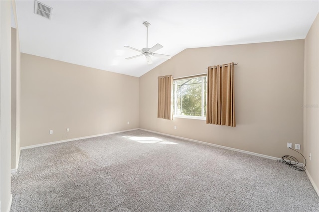 carpeted empty room with ceiling fan and lofted ceiling