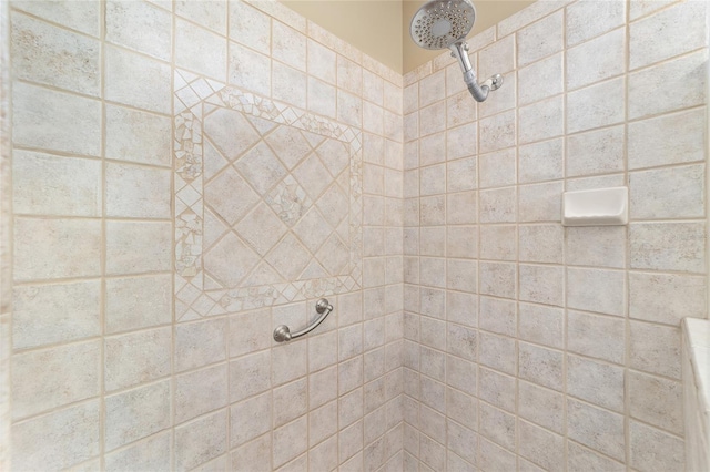 bathroom with a tile shower