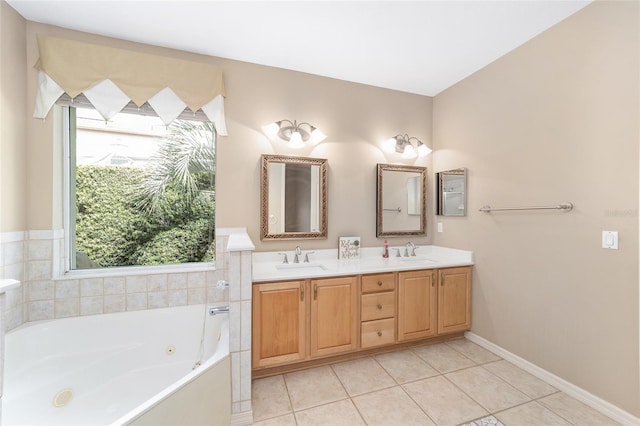 bathroom featuring a washtub, vanity, and tile patterned floors