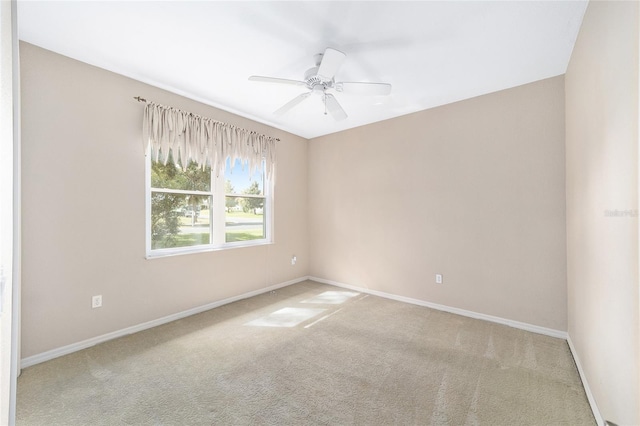 empty room featuring ceiling fan and carpet flooring